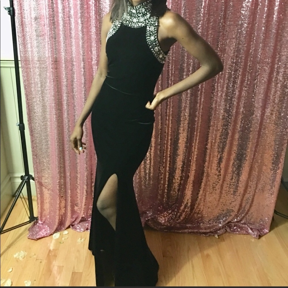 Black velvet dress with a mock neck.